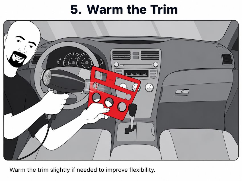 Using a hair dryer to prepare dashboard trim for fitting